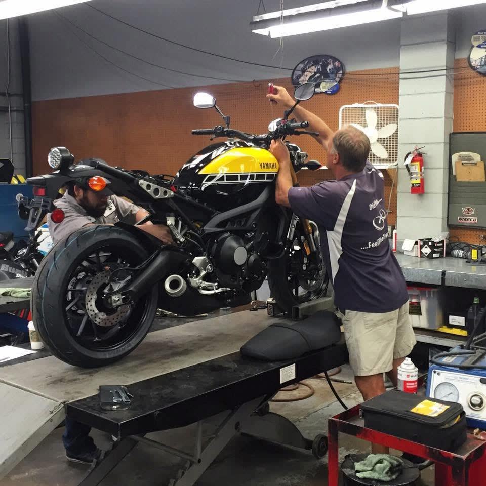 Motorcycle up on the lift mid-service